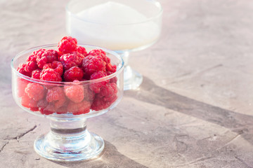 Glass of fresh raspberries and white sugar gardening gastronomy harvest