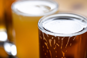 Close up on an overflowing pint of beer