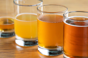 Close up on a row of beer glasses with ascending volumes