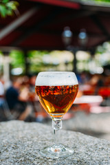 Cold beer glass on at beer garden