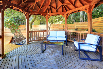 Fabulous gazebo on backyard deck with outdoor furniture