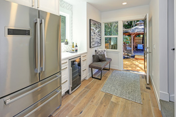 Interior of hallway with open door to the backyard.