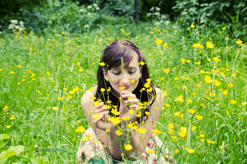 portrait of young woman in the summer garden