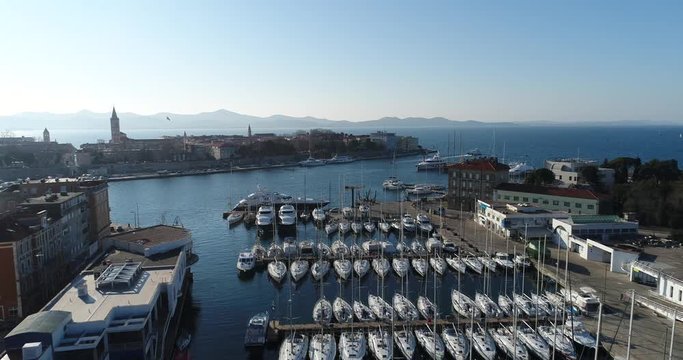 Aerial fly over Zadar marina and flying to Zadar peninsula, Zadar, Mediterranean, Adratic sea, Croatia