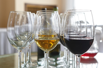 Glasses of red and white wine on a tray