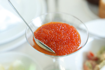 Glass with red caviar
