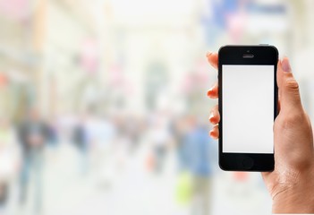 Hand Holding an Phone on city background