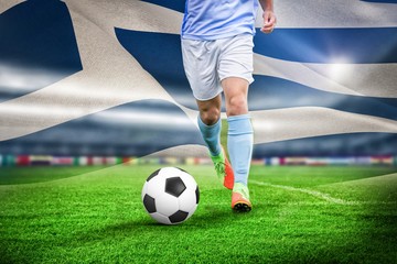 Composite image of male soccer player playing football