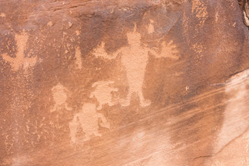 Odd rock carvings of various sized people