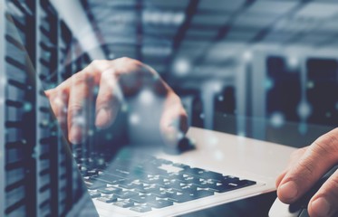 Laptop with padlock and server farm, data security concept