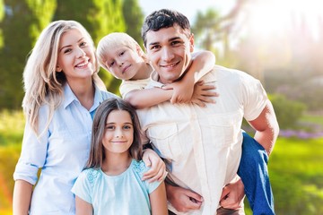 Beautiful smiling Lovely family on park