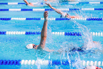 Backstroke swimmers in a race