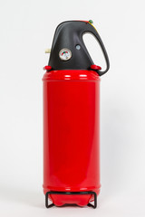 Obraz premium Chemical Fire extinguisher red tank isolated on white background