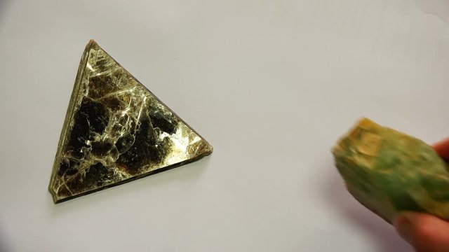 minerals of different shapes lined in white background.