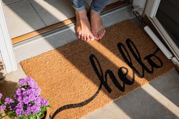 welcome mat in front of new home - obrazy, fototapety, plakaty
