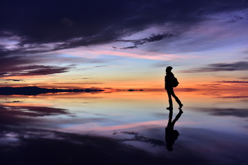 Fototapeta na wymiar Calm woman dancing with sunset beach lake nature