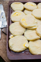 Cooked khachapuri bread with suluguni cheese and butter. Georgian traditional food.