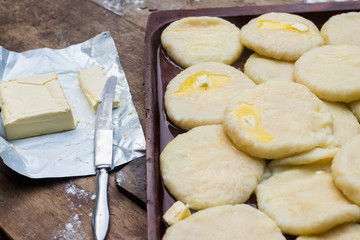 Cooked khachapuri bread with suluguni cheese and butter. Georgian traditional food.