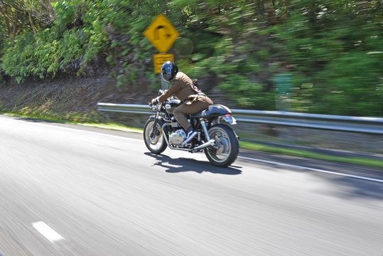 Dapper cafe racer motorcycle rider