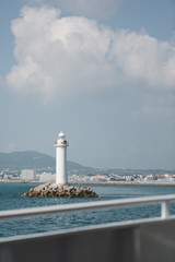 Naklejka premium Small Lighthouse In The Middle Of Ocean