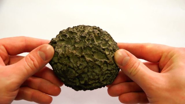 in the form of an irregular circle, a mineral of volcanic origin.