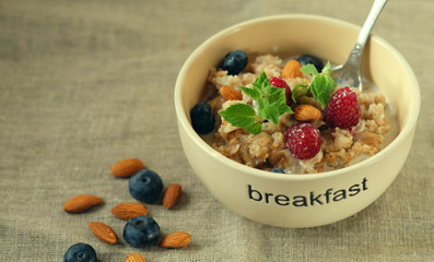 Granola with fresh organic raspberries and blueberries.