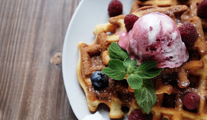 Belgian waffles with fresh berries and ice cream 