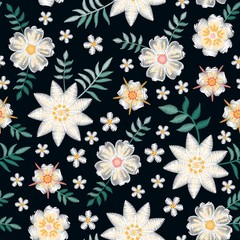 Embroidery seamless pattern with beautiful white flowers on black background. Summer print. Fashion design. Vector embroidered illustration.