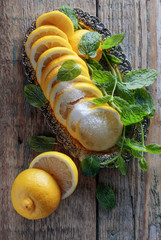 Lemon slices with sugar and mint.