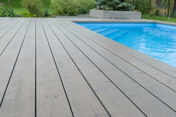 Special wooden board around the swimming pool, texture, background.