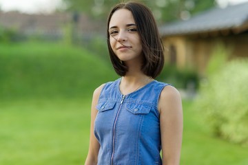 Outdoor portrait of a pretty young girl 16 years old.