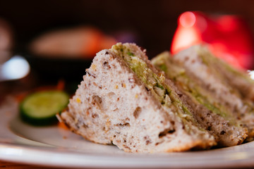 Chicken avocado sandwich in a plate.