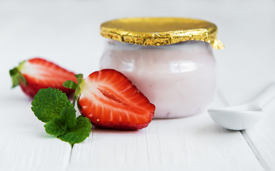 Jar with strawberry yogurt