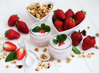 healthy breakfast, yogurt, fresh strawberries and granola