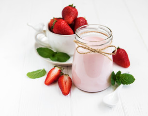 Jar with strawberry yogurt