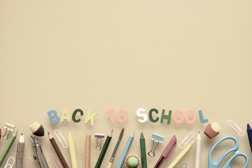 Back to school background concept. Back to Scool wood text arrange on Yellow background with School supplies, stationery accessories. Flat lay, top view