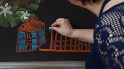 the teacher draws on a blackboard. Great clip for your education, school or learning projects.