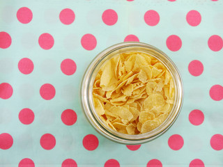 top view closeup of cornflakes in grasses bottle