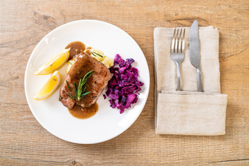 pork steak with red cabbage and mashed potatoes