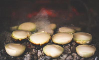 onions with lard on the grill