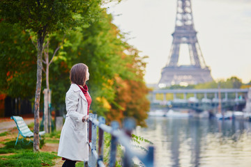 Young woman in Paris near the Eiffel tower