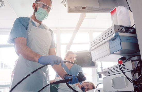 Internist doctors during stomach examination working as a team