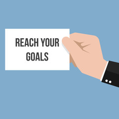 Man showing paper REACH YOUR GOALS
