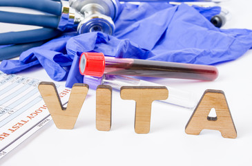 Fototapeta na wymiar Vit A vitamin A acronym or abbreviation diagnostics or medical laboratory test photo concept. Word Vit A is background of blood sample in test tube, protective gloves and hematological blood analysis