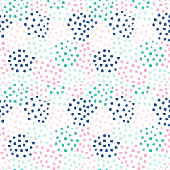 Abstract vector seamless pattern with hand drawnd round shapes in groups of different colors for textile, clothing and backgrounds