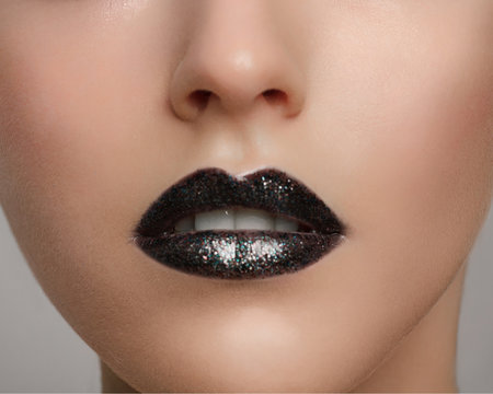 Halloween makeup. Expression rock style lip make-up like a vampire, dark romantic. Fashion look, black mat lips
