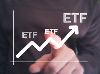 Financier presses etf Exchange Traded Fund button on virtual diagram interface. - 216943507
