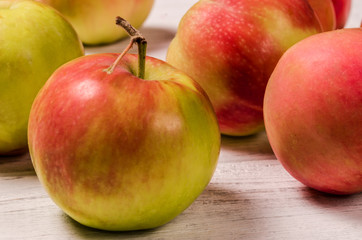 Ripe apples on a wooden table. Apple close-up.