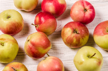 Ripe apples on a wooden table. Apples close-up. Top view.