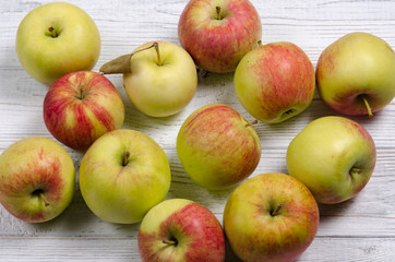 Ripe apples on a wooden table. Apples close-up. Top view.